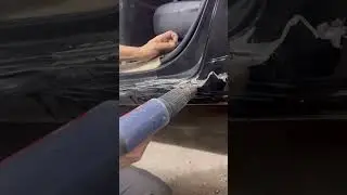 Car door repair using an electric suction device