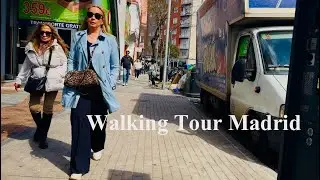 Walking down the street of Madrid, traffic, movement of people