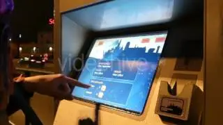 Girl's Finger Put Coins to Ticket Automat.
