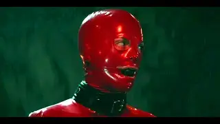 Who is the Guy in the Red Latex?
