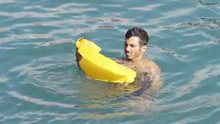 OneUP - Portable life preserver that inflates when in contact with water.