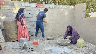 The Chavil family plasters the house wall to strengthen the house and protect it from the cold