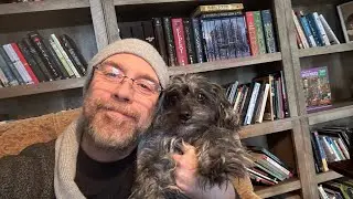 Reading To Dogs - By A Blazing Blue Sea