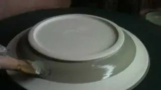 Brushing Glazes On The Potter's Wheel