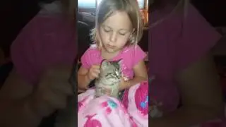 My sister holding our kitty
