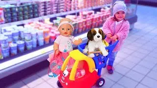 Babies dolls and funny kid doing shopping