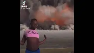 Boy dancing to America Has A Problem while explosions in the background