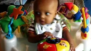 Myles and baby einstein exersaucer