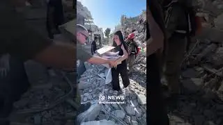 People inspect damage in Tel Aviv after Iranian missile strikes