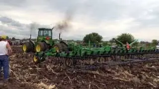 Three John Deere 830s pulling a 45 foot field cultivator