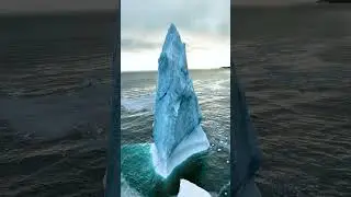 Icebergs form when large chunks of ice break off from glaciers, known as calving 🧊 #Shorts #Science
