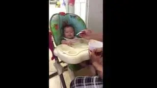 Zealyn's first time eating rice cereal