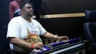 Dhananjay Mishra ji,India's famous music director,playing Banjo in a Recording.