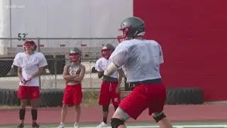 Adam Bell brings intensity from the wrestling mat to the gridiron for Volunteers