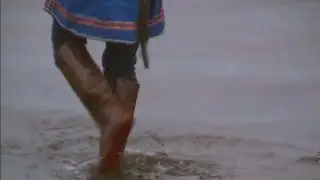 In patterned rubber boots