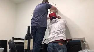 A DIY Wine Wall in Arvada, Co, featuring VintageView Wine Storage Systems metal wine racks