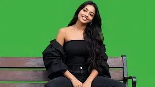 Beautiful woman sitting on park bench green screen | Top and jeans girl green screen video