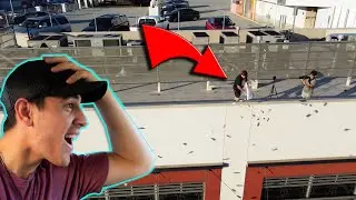 THROWING MONEY OFF A ROOF IN LA!! (Security caught us!)
