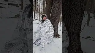 Pocket sized heated survival shelter