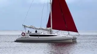 Yacht with red sails