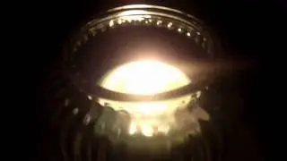 Burning Candle in a Glass Jar