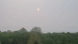 sun behind fire smoke