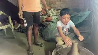 Ayaan doing pottery