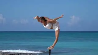 Handstand on the beach by Liliia Krylova