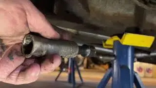 Installing five leaf rear springs on the 55 chevy.