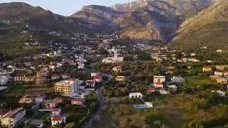 City at the Foot of Majestic Rocky Mountains 🏙️⛰️