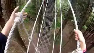 Julie walks across the zip ling Bridge