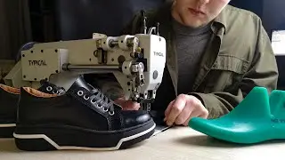 Sewing handmade sneakers from black leather