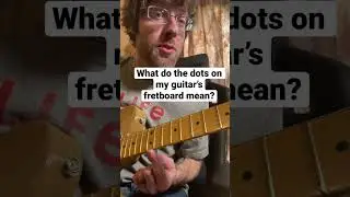 What do these dots on my fretboard mean? 