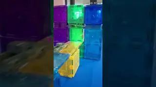 Launching Hot Wheels cars through a Magnet Tiles Trap Door in Slow Motion and Reverse 