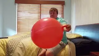 blowing up a red punch ball balloon (requested by Michael Copeland)