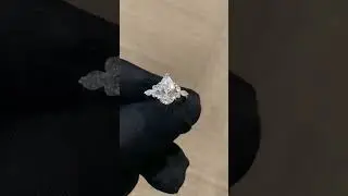 2.50 carat Pear Shape Diamond Engagement Ring with Round and Marquise diamonds on the side.