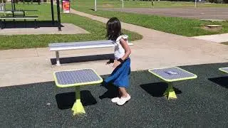 Anusha is having little fun in a public park
