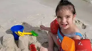 Family fun day at the Beach and playing in the sand 