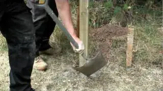 How to install a fence post into soil