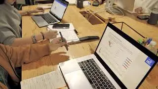 People working with Macbook on a wooden table | Free stock Apple video