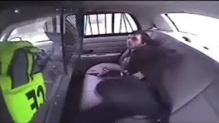 A man tries to escape from a police car, but something went wrong