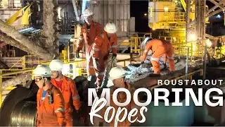 Roustabout working on mooring ropes