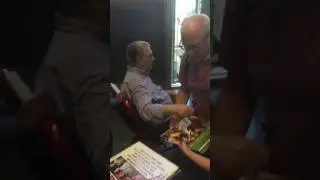 Brian Wilson of The Beach Boys signing autographs