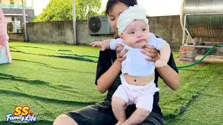 SO CUTE! Baby Kim looks like a doll in her all-white outfit
