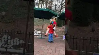 Cast member gives Pinocchio a piggyback