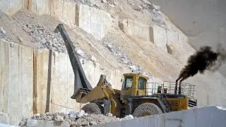 Komatsu WA800 Loader Dominates Quarry with Powerful Rock Rake Attachment