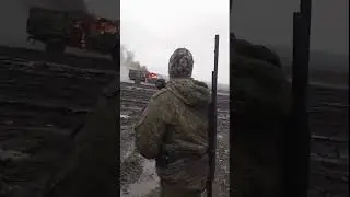 A Russian serviceman watches a destroyed Ural truck by of a heavy strike drone.#russia #ukraine