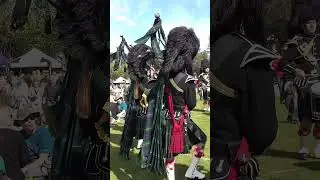 The Lonach Pipe Band march in playing Rowan Tree during 2023 Braemar Gathering in 