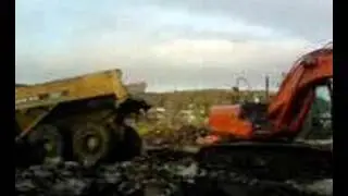 A Gps excavator Hitatchi loading Dumper