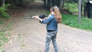 Girl shooting AR.